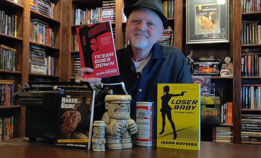 Crime fiction author Jason Bovberg with his books