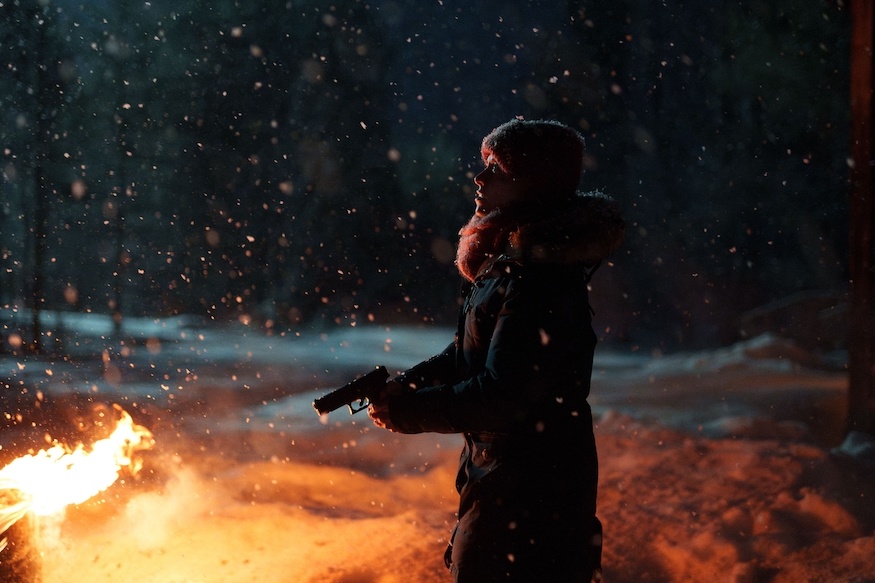 Arctic Circle Finnish crime show woman with gun, snow and fire
