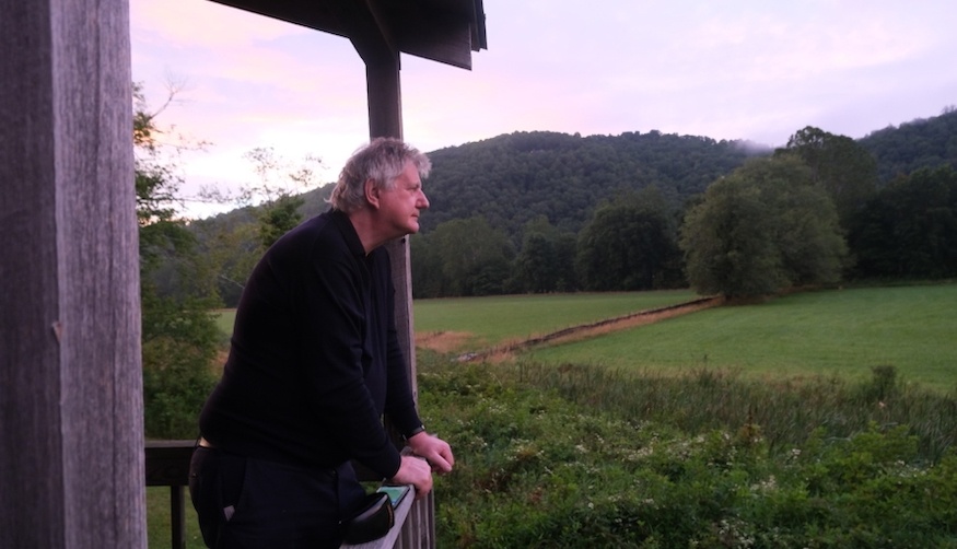 landscape photo of Oliver Johnson, author, with woodland backdrop