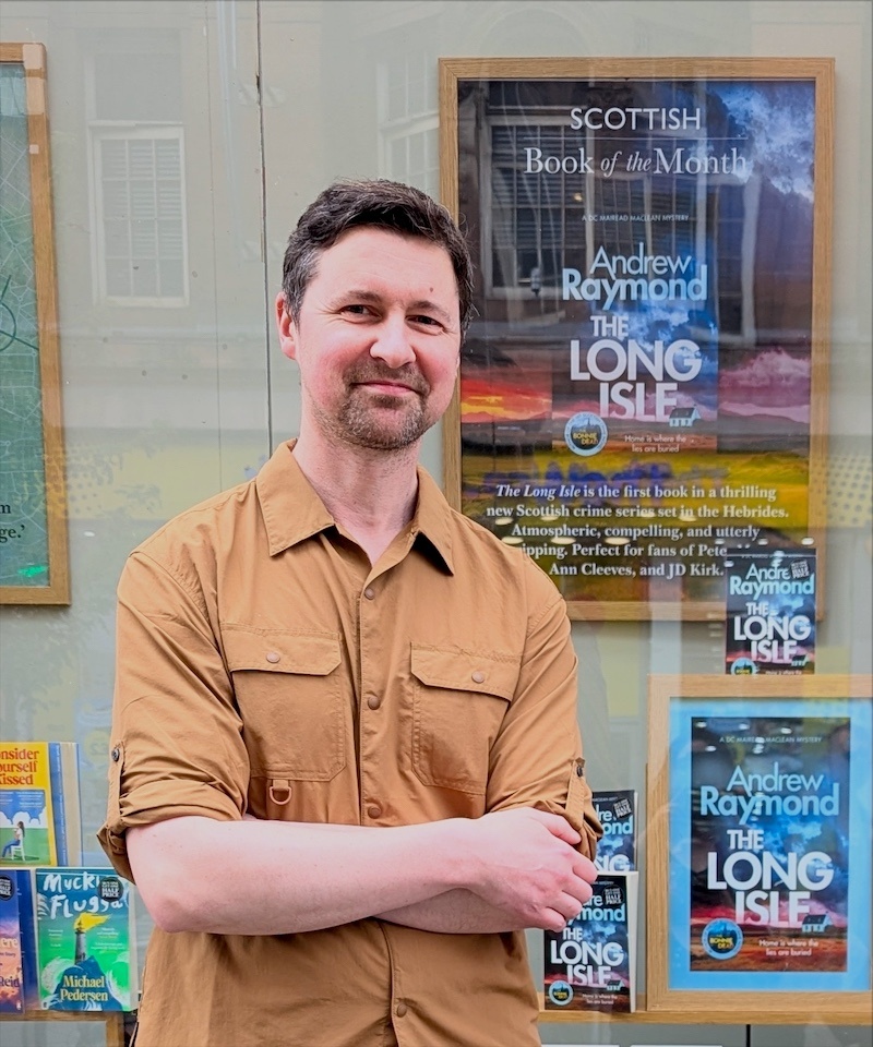 Scottish crime author Andrew Raymond standing outside Waterstones