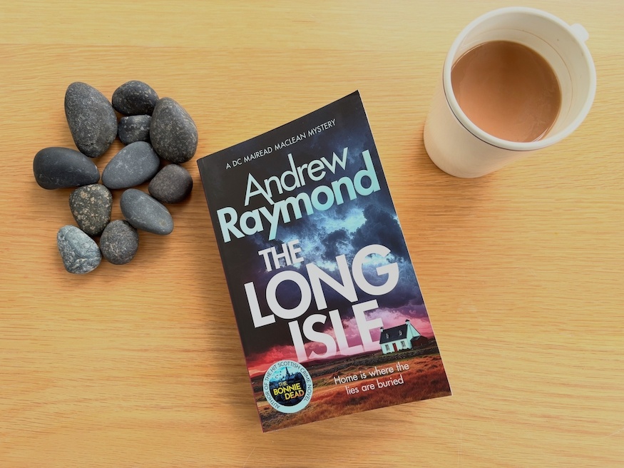 Photo of The Long Isle by Andrew Raymond with sea pebbles and a cup of tea