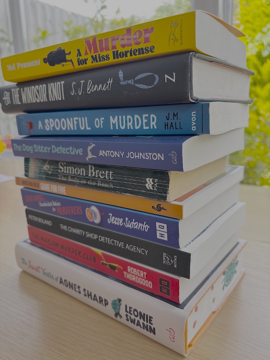 stack of 10 books from the best cosy crime mystery series