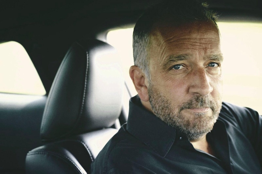 Crime fiction author George Pelecanos in a car landscape photo
